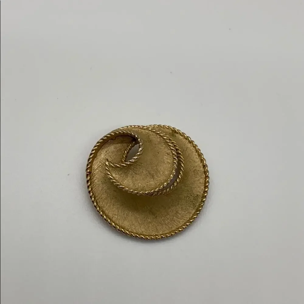 Trifari Gold swirl brooch